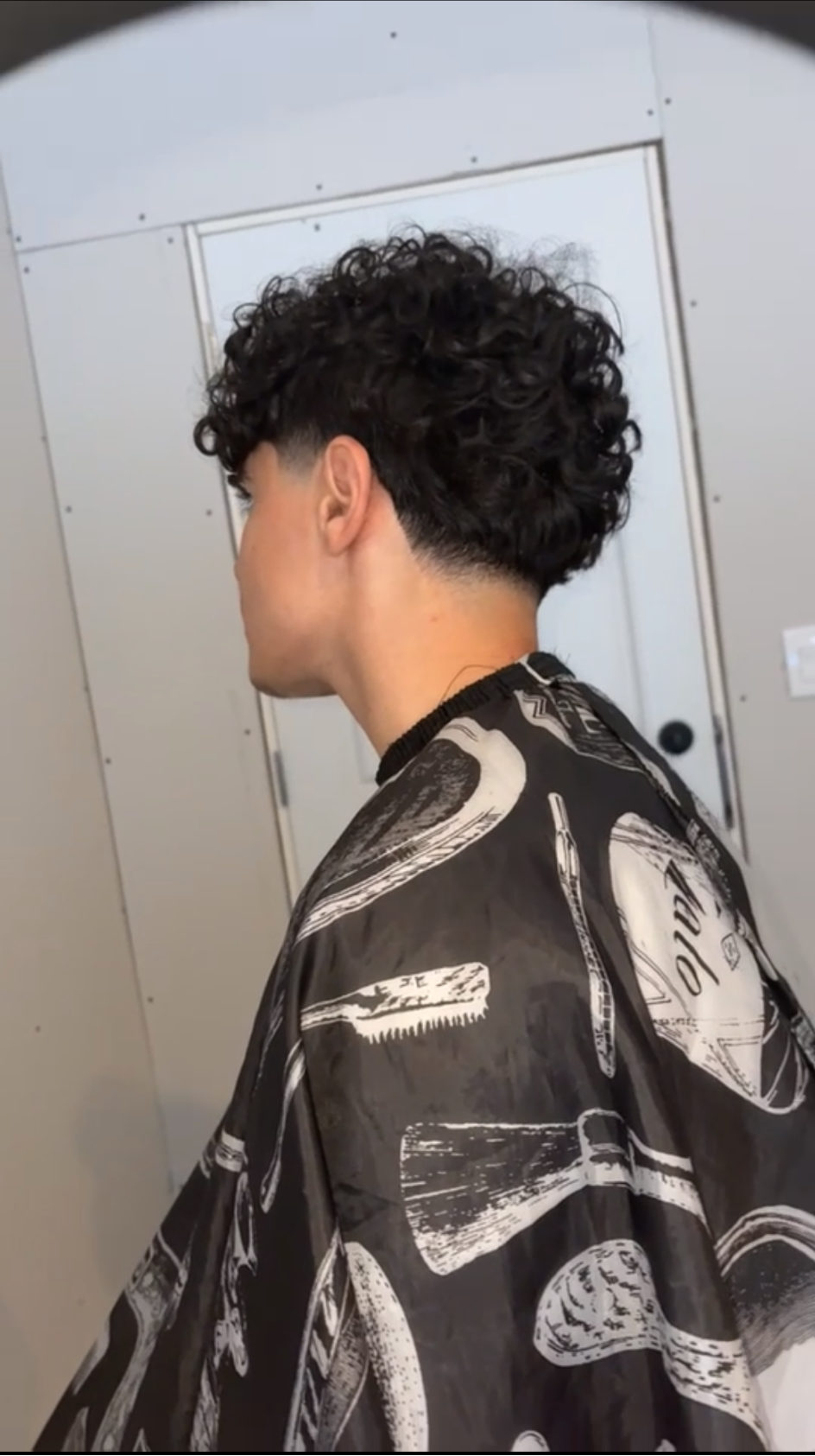 Curly taper with a clean neckline